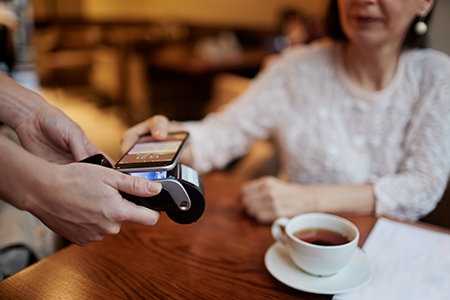 Customer making a payment by tapping